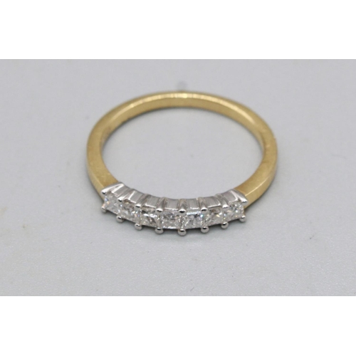 56 - 18ct yellow gold ring set with row of seven square cut diamonds, stamped 750, size M, 2.4g