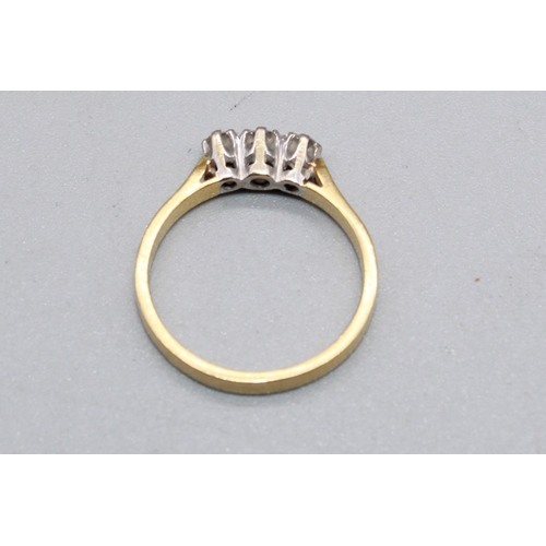57 - 18ct yellow gold three stone diamond ring, stamped 750, size M, 2.8g