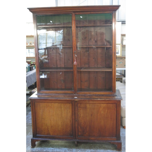 306 - Victorian mahogany bookcase, glazed top with three shelves, base with two doors on bracket feet, W13... 