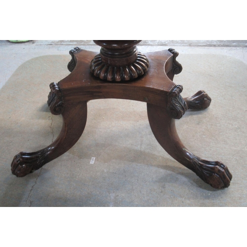 308 - Regency mahogany tea table, folding top on vase turned column and platform base with four paw feet, ... 