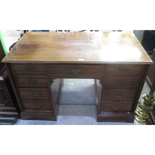 318 - Victorian walnut kneehole desk, the nine drawers with angular brass handled on plinth base, W122cm D... 