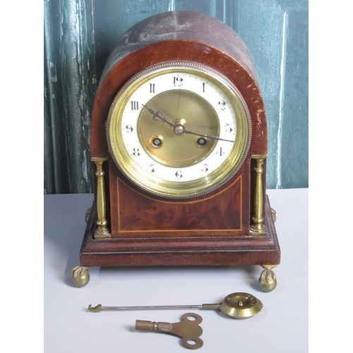 282 - Edwardian inlaid mahogany arched top mantle clock with circular Arabic chapter, brass columns and cl... 