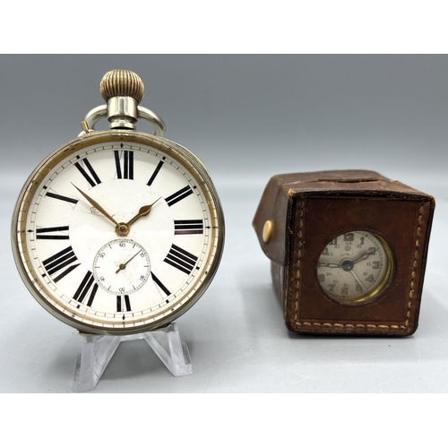 141 - Junghans japanned steel and brass miniature travel alarm clock with original leather travel case, si... 