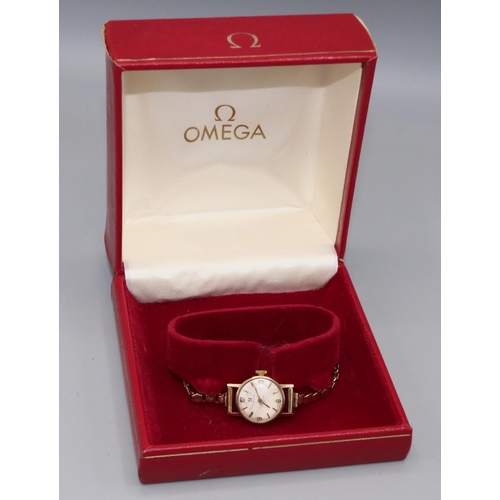 192 - Ladies Omega gold wristwatch on matched gold hallmarked bracelet, signed silvered dial with applied ... 