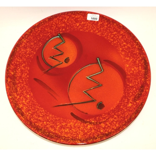 1000 - Anita Harris art pottery, charger in red and orange glaze with abstract design, D42cm