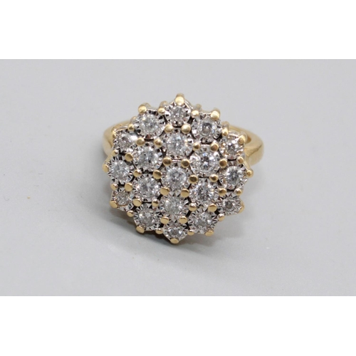 33 - 18ct yellow gold diamond cluster ring set with nineteen brilliant cut diamonds in illusion settings,... 