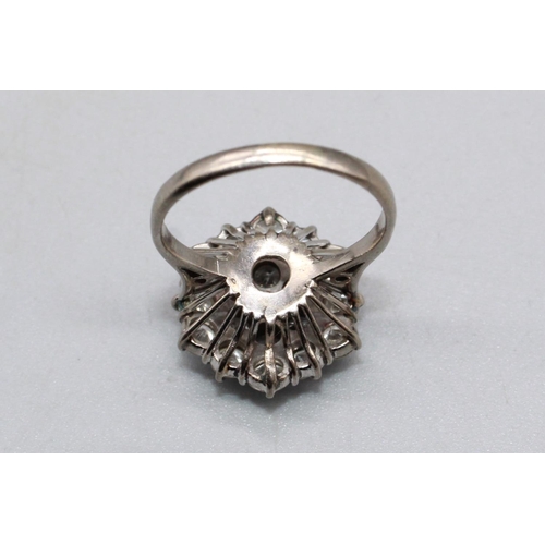 36 - White metal diamond cluster ring, set with nineteen brilliant cut diamonds, stamp worn but possibly ... 