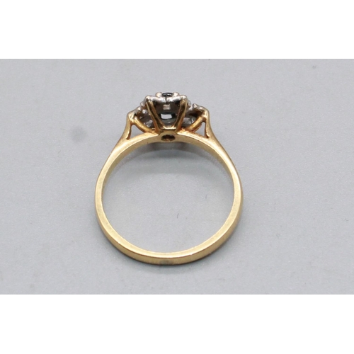 68 - 18ct yellow gold sapphire and diamond star cluster ring, stamped 18, size N, 3.2g