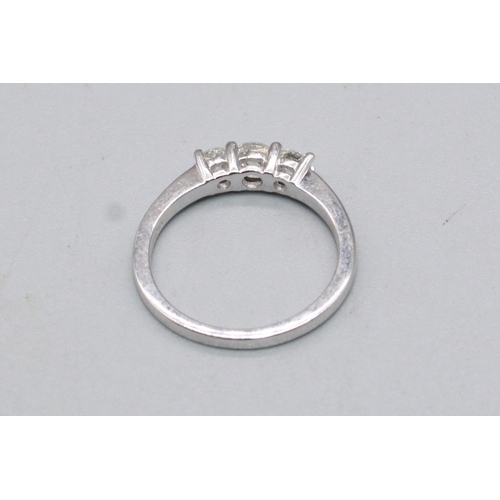 89 - 18ct white gold ring set with three brilliant cut diamonds, stamped 750, size M, 3.1g