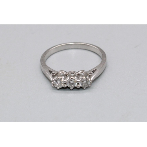 91 - 18ct white gold three stone diamond ring, set with three brilliant cut diamonds, stamped 750, size L... 