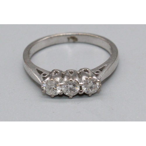 92 - 18ct white gold three stone diamond ring, stamped 750, size L, 3.4g