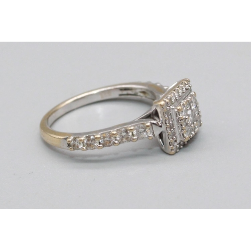 93 - 18ct white gold square faced ring set with brilliant cut diamonds, on diamond set shoulders, stamped... 