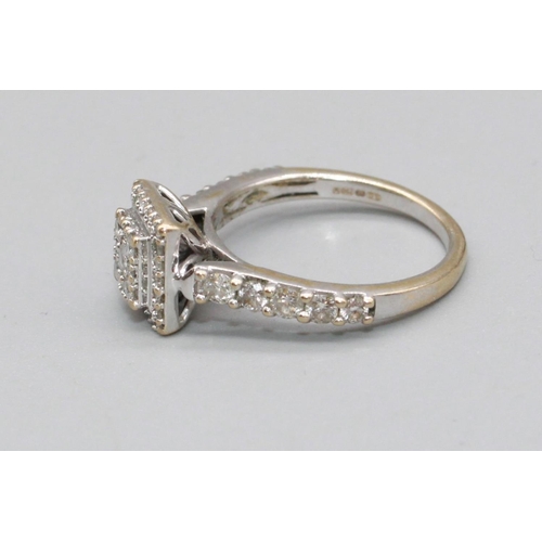 93 - 18ct white gold square faced ring set with brilliant cut diamonds, on diamond set shoulders, stamped... 