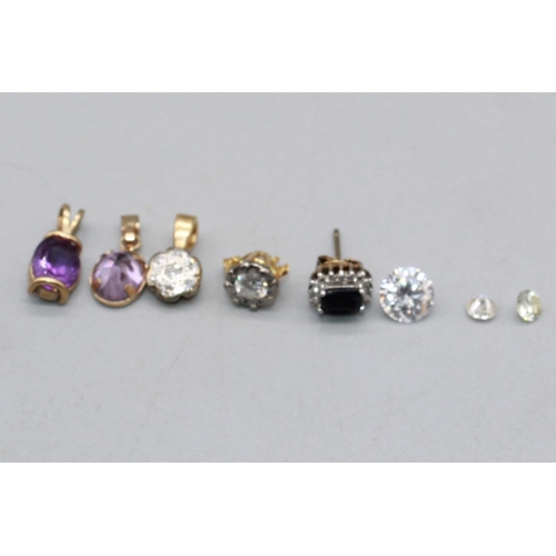 98 - Two small unmounted diamonds, a larger clear stone, a yellow and white metal cluster drop pendant, a... 