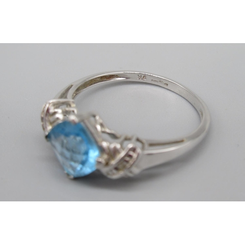 705 - 9ct white gold single stone blue stone ring, stamped 375, and a pair of matching earrings stamped 9k... 