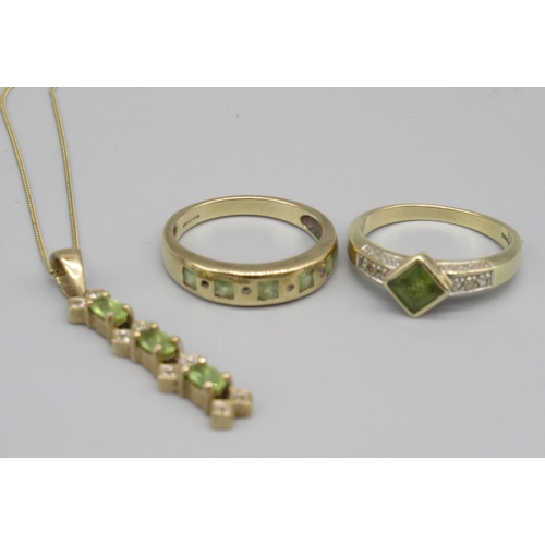 706 - Two 9ct gold white stone and peridot rings and a similar pendant, 8.6g(3)