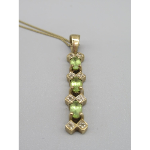 706 - Two 9ct gold white stone and peridot rings and a similar pendant, 8.6g(3)