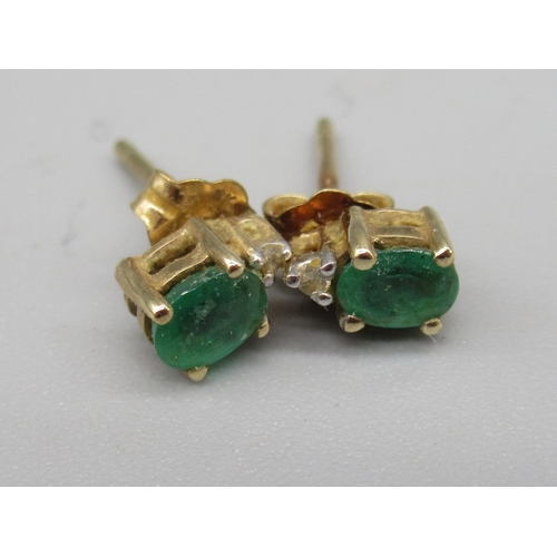 709 - 9ct gold single stone emerald ring, stamped 375, and two pairs of emerald earrings stamped 9k (5)