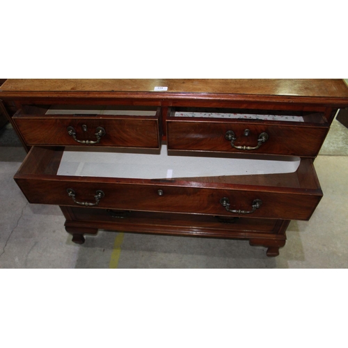 319 - Geo. III mahogany chest, figured top above two short and three long drawers with brass swan neck han... 