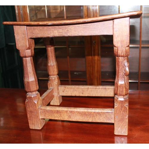 323A - Robert Mouseman Thompson of Kilburn - an oak joint type stool, nailed rectangular adzed dished top o... 