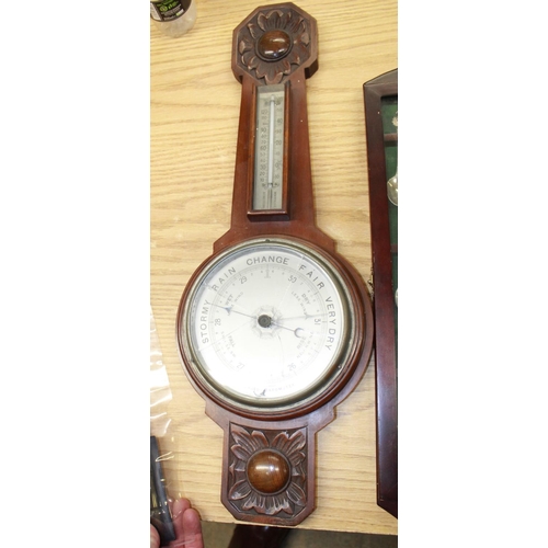 172 - Collection of EPNS souvenir spoons in two glazed cabinets and C20th mahogany aneroid wheel barometer... 