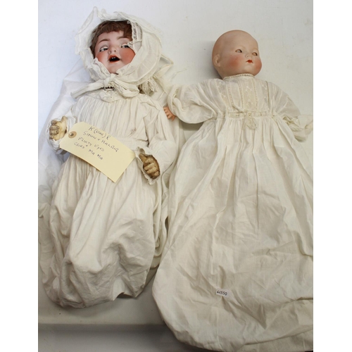 399 - Two early 20th century bisque head baby dolls: crying doll marked Simon and Halbig 126, white gown a... 