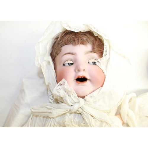 399 - Two early 20th century bisque head baby dolls: crying doll marked Simon and Halbig 126, white gown a... 