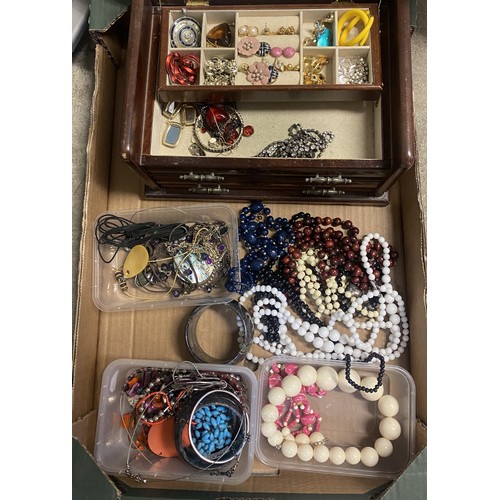 188 - Large collection of costume jewellery including beaded necklace, bangles, earrings etc. with a woode... 