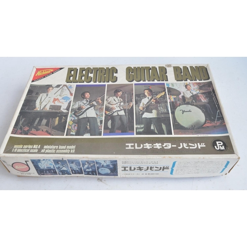 105 - Rare Nichimo 1/8 scale Electric Guitar Band plastic model kit set, unstarted with sprues in factory ... 