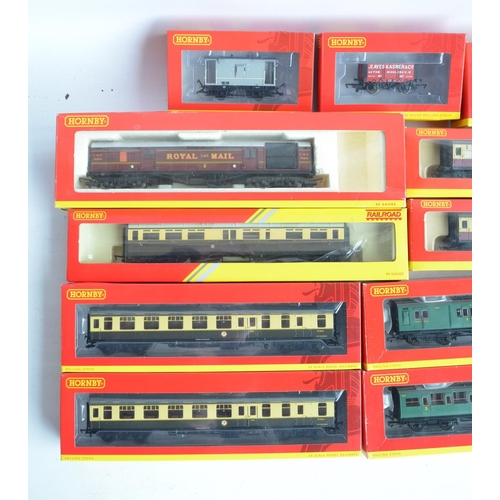 143 - Collection of boxed OO gauge passenger coach and goods wagons from Hornby and Bachmann to include Ho... 