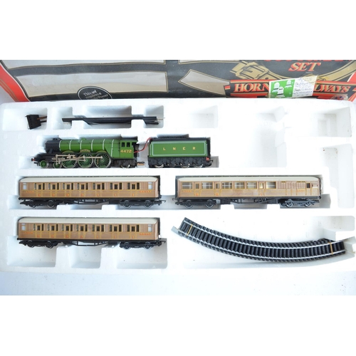 150 - Collection of previously run OO gauge railway models and accessories from Hornby to include an R324 ... 