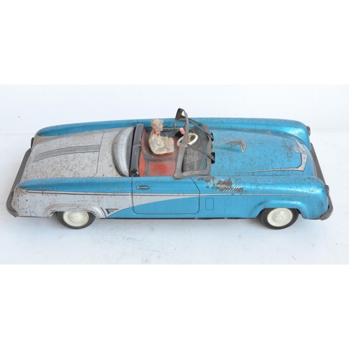 173 - Vintage West German lithographed pressed steel push along friction powered car model with working wi... 