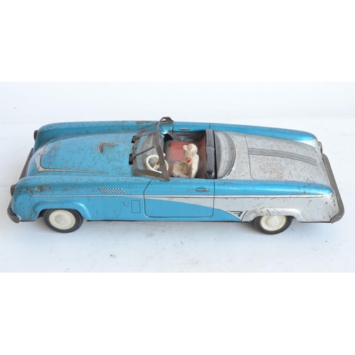 173 - Vintage West German lithographed pressed steel push along friction powered car model with working wi... 