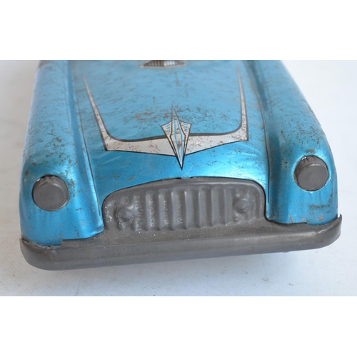 173 - Vintage West German lithographed pressed steel push along friction powered car model with working wi... 