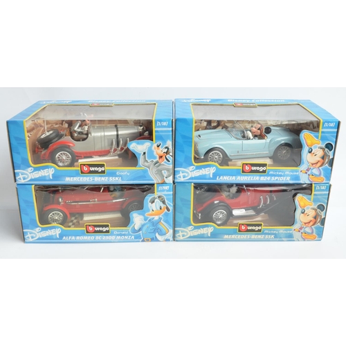 192 - Four 1/18 scale diecast Disney themed model cars from Burago to include Mickey Mouse Lancia Aurelia ... 