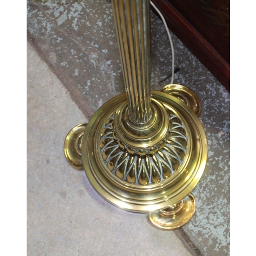 324 - Brass standard lamp, fluted column on stepped lobed circular base with D shaped feet, H158cm