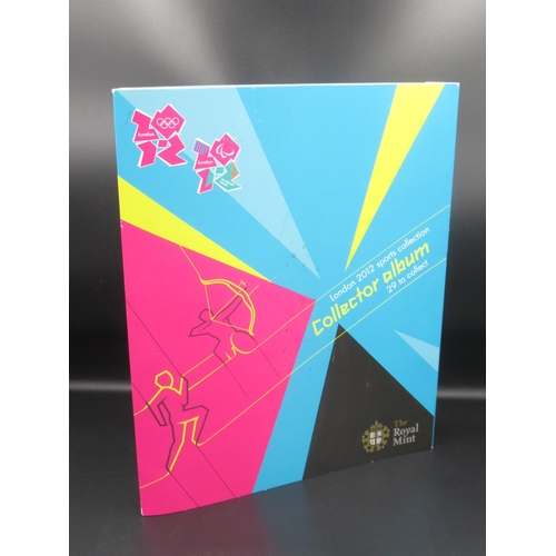 737 - Royal Mint - London 2012 Sports Collection Collector Album, containing twenty-nine carded commemorat... 