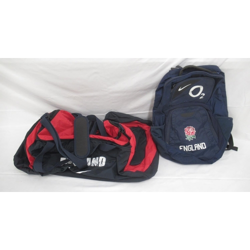 951 - Collection of assorted Rugby related clothing to inc. a England 02 suitcase, rucksack and travel bag... 