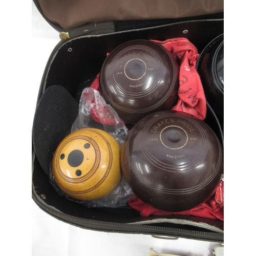 954 - 3 Sets of Crown Green Bowls, a Jack and measures in travel bag.