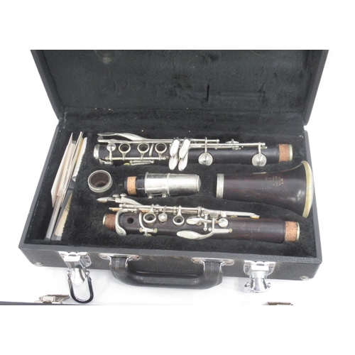 924 - Cased Boosey & Hawkes Series 2-20 clarinet and a cased Blessing Elkhart flue (2)