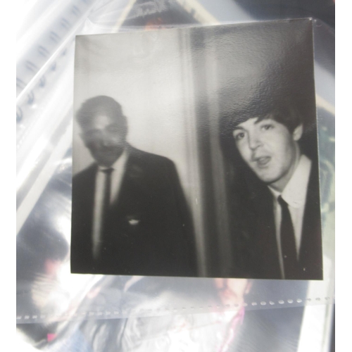 931 - Beatles - folder cont. 14 movie cells relating to the Beatles, Transparencies, photos, etc.