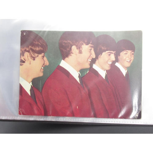 931 - Beatles - folder cont. 14 movie cells relating to the Beatles, Transparencies, photos, etc.