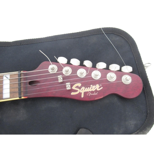 926 - Squier by Fender electric guitar, Boss TU-80 Tuner & Metronome, with a Squier by Fender branded blac... 