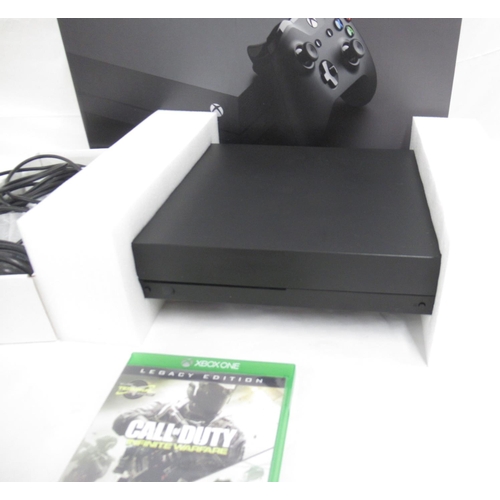 291 - Xbox One X console with controller and original box, with Call of Duty Legacy Edition Advanced Warfa... 