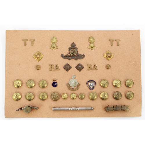 1061 - Card containing collection of brass buttons, cap badge shoulder titles for the Royal Artillery. Home... 