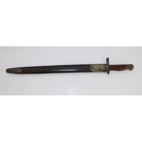 1086 - 1911 US Army Bayonet complete with original leather scabbard.