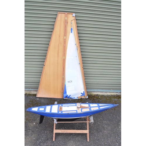 265 - Large fibre glass radio controlled yacht model with mast/sail case. Hull length 161cm