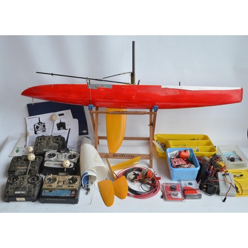 266 - Fibre glass hulled radio controlled yacht model (L122xW14xH236cm) and a collection of hand held tran... 