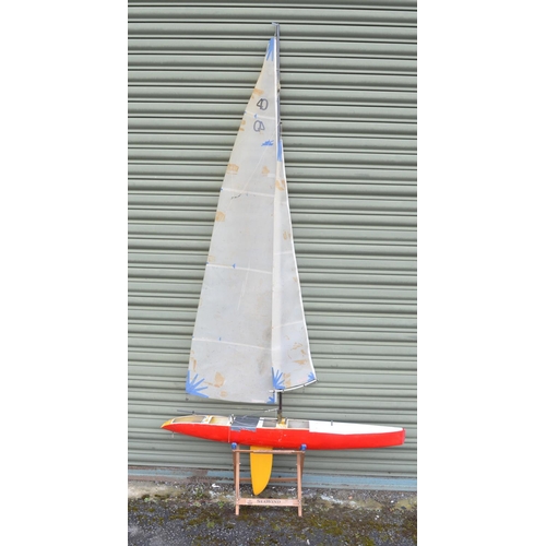 266 - Fibre glass hulled radio controlled yacht model (L122xW14xH236cm) and a collection of hand held tran... 