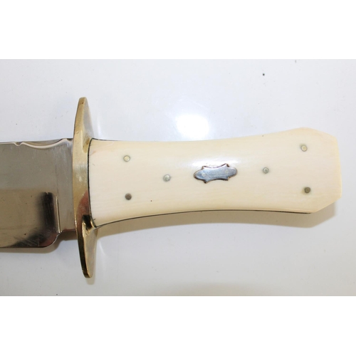 1103 - WITHDRAWN - Hand Forged display Bowie knife with polished steel blade, nickel cross-guard, and 'coff... 